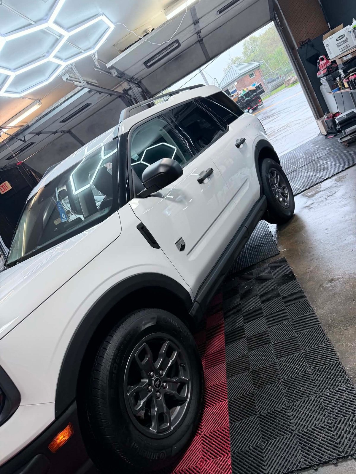 Basic Detail — white SUV in the showroom after a full detail