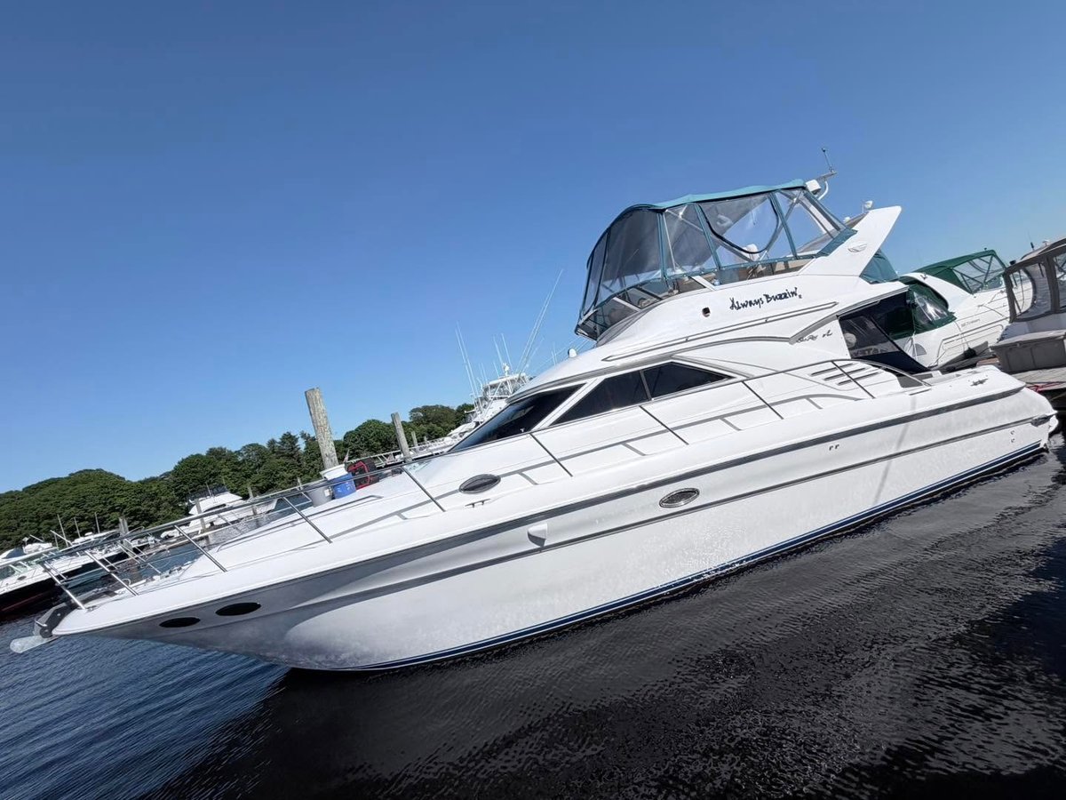 White and black luxury yacht docked at the marina after a full detail