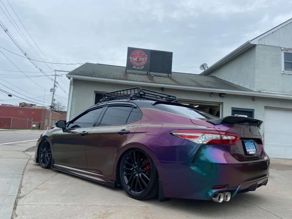 Purple-to-teal iridescent Toyota with a custom finish outside the studio